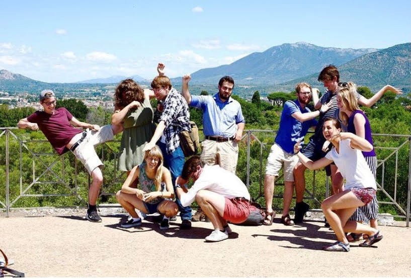 students in front of mountain backdrop