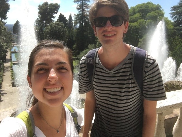 students in front of fountain