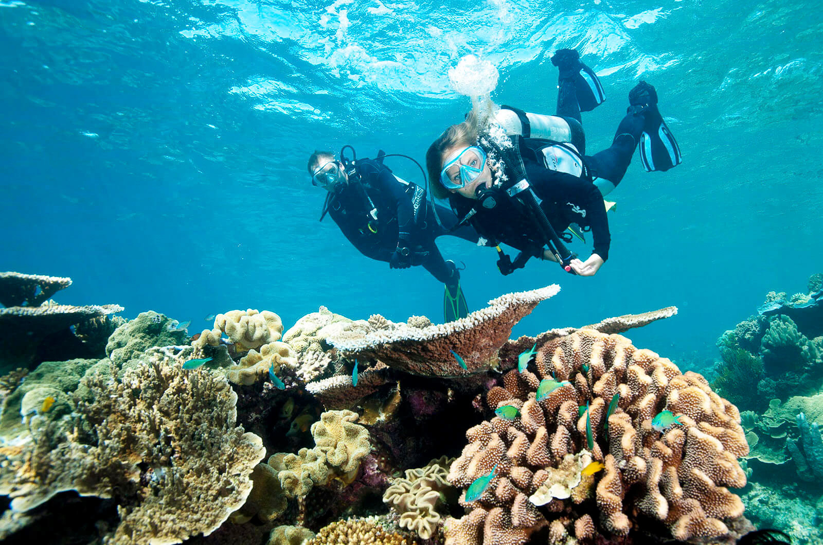 two students scuba diving