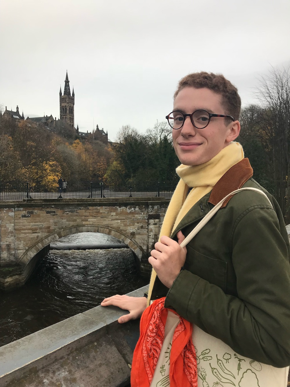 student standing next to bridge